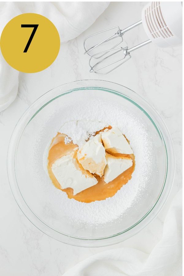Cream cheese, powdered sugar and vanilla in a bowl for the glaze.