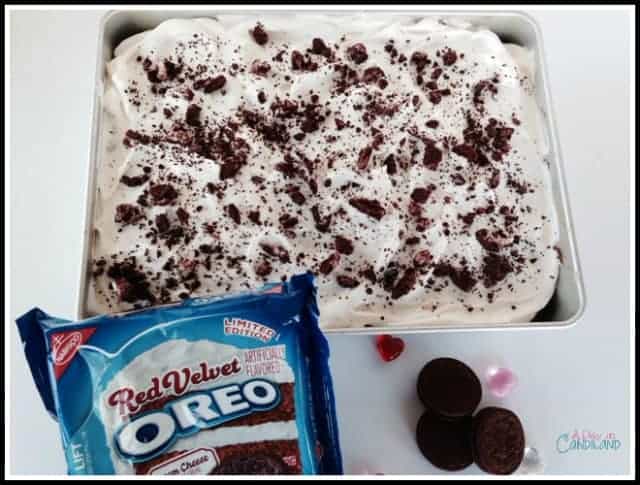 Red Velvet Oreo Poke Cake with cookies