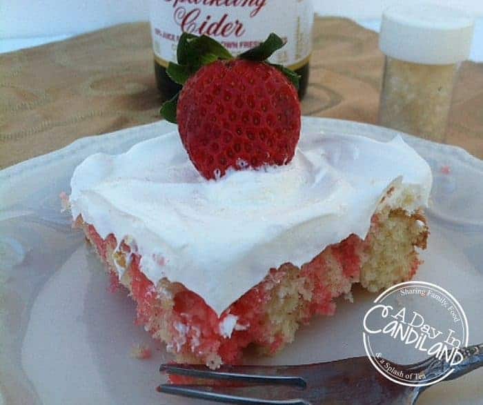 Slice of Sparkling cider strawberry poke cake