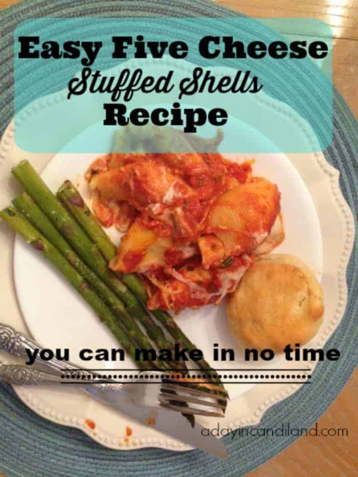 Easy Stuffed Shells Recipe on a plate with asparagus and dinner roll