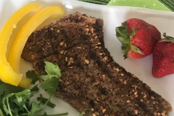 A New York steak with peppers and strawberries 