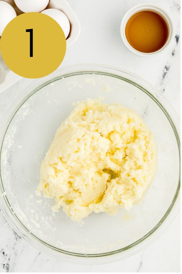 Butter and sugar creamed until light and fluffy in a glass bowl.