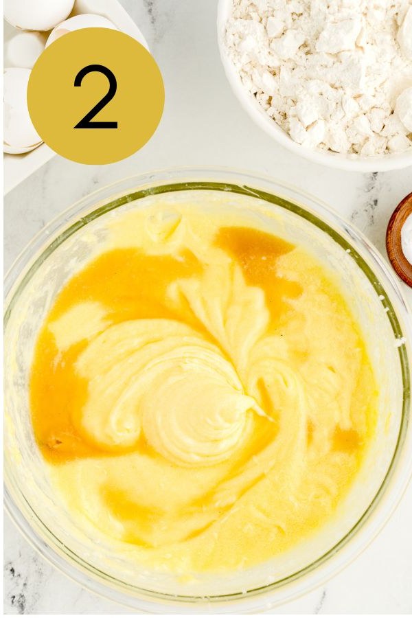 Eggs and vanilla beaten into the creamed butter.