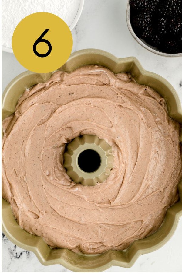 The batter poured into the prepared bundt pan.