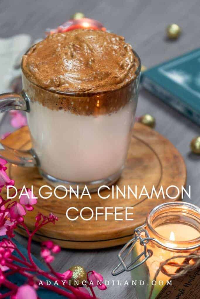 Dalgona Cinnamon Coffee in clear Glass on wooden coaster