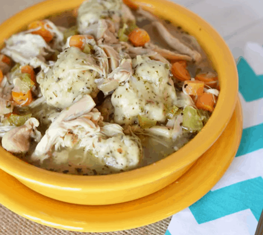 A bowl of chicken and dumplings 