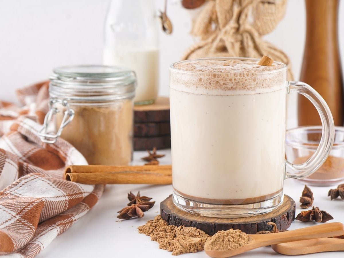 Mug of Chai Tea with spices on the table.