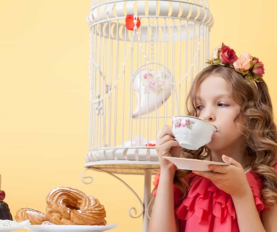 Girl dressed up sipping tea 