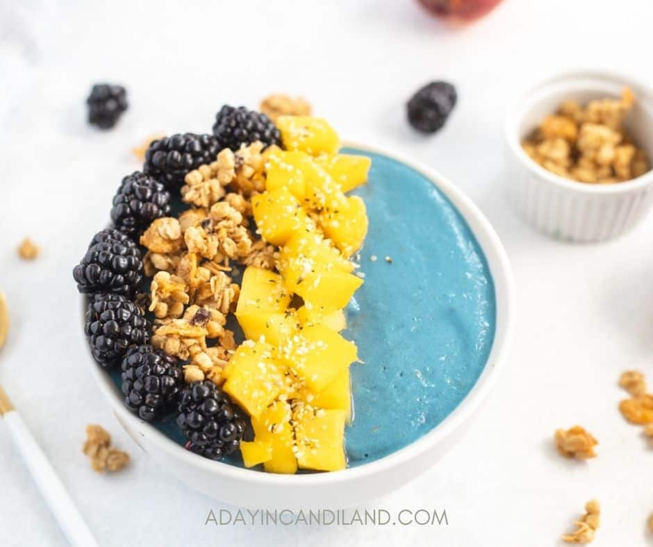 Blue Smoothie Bowl topped with mango, granola, and blackberries