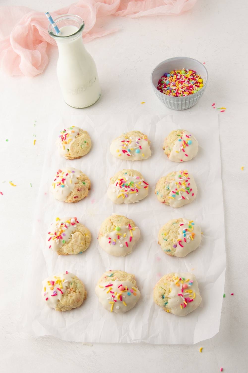 Funfetti Cookies on a piece of parchment paper. 