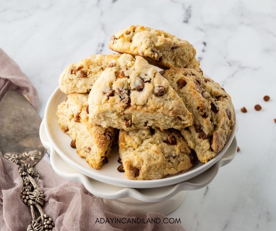 Cinnamon Chip scones stacked on a white plate. 