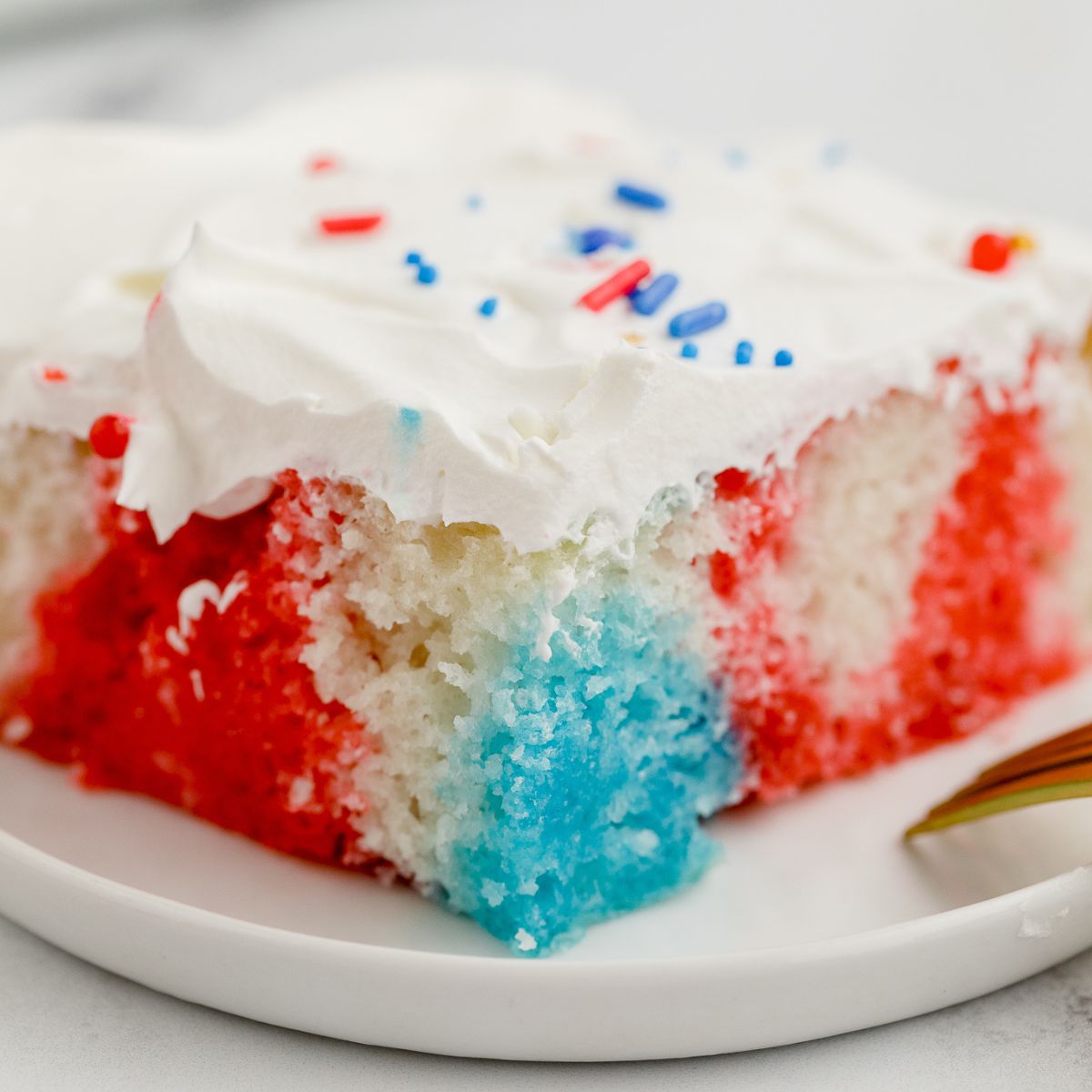 Slice of Patriotic Poke Cake.