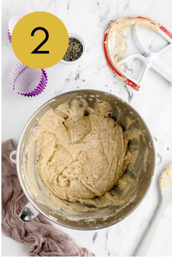 The thick Earl Grey cupcake batter flecked with tea leaves after the dry ingredients are mixed in.