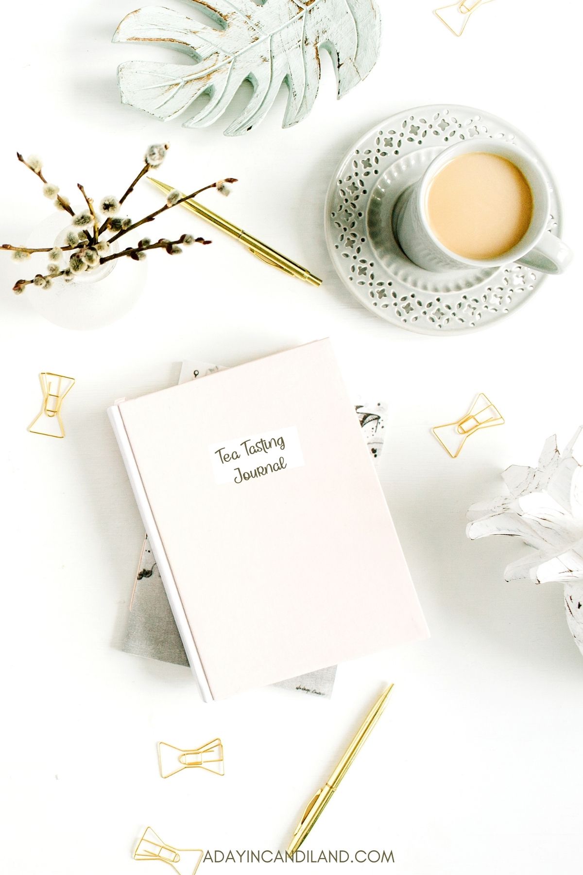 Tea Tasting Journal on a desk with a cup of tea. 