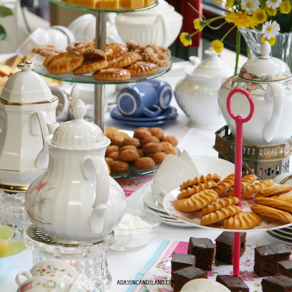 A Table with Teapots and cakes and desserts for an Afternoon Tea Party. 