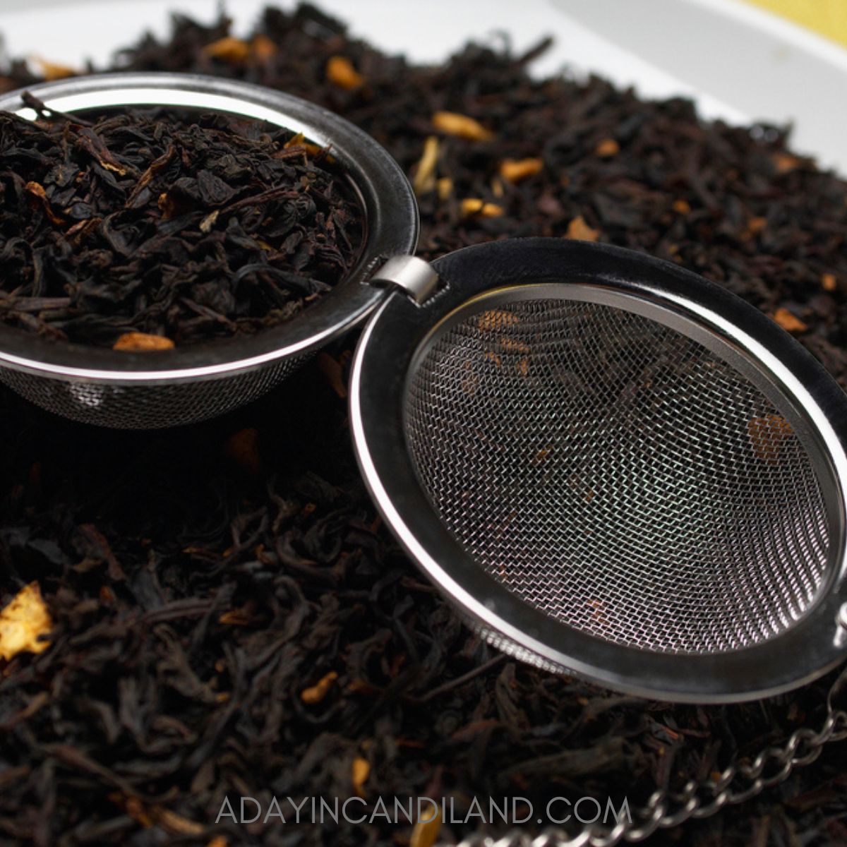 Tea Ball strainer with loose tea leaves. 