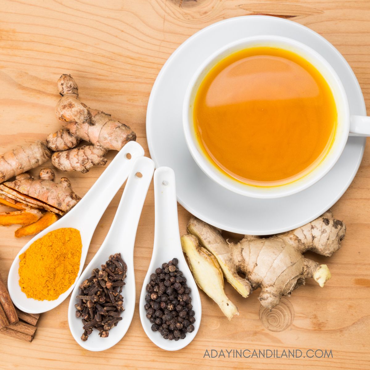 Teacup of Turmeric Tea with Ginger root. 