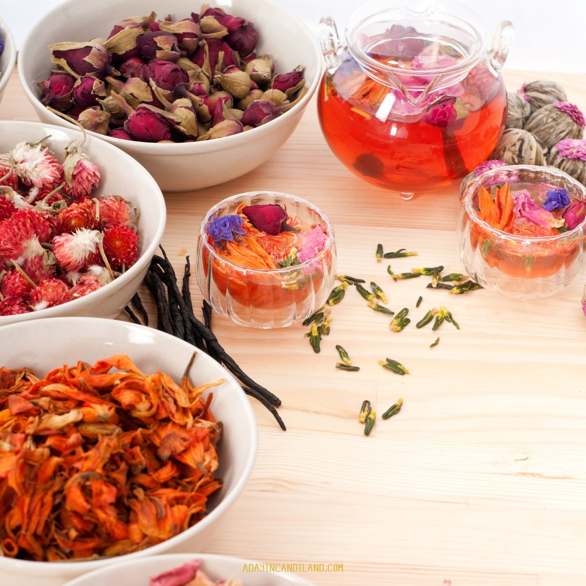 Bowls of floral teas on a table. 