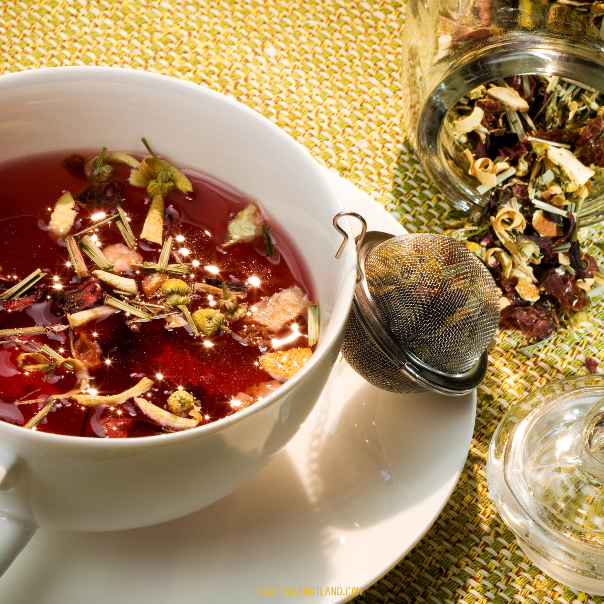 A cup of floral tea on a table. 