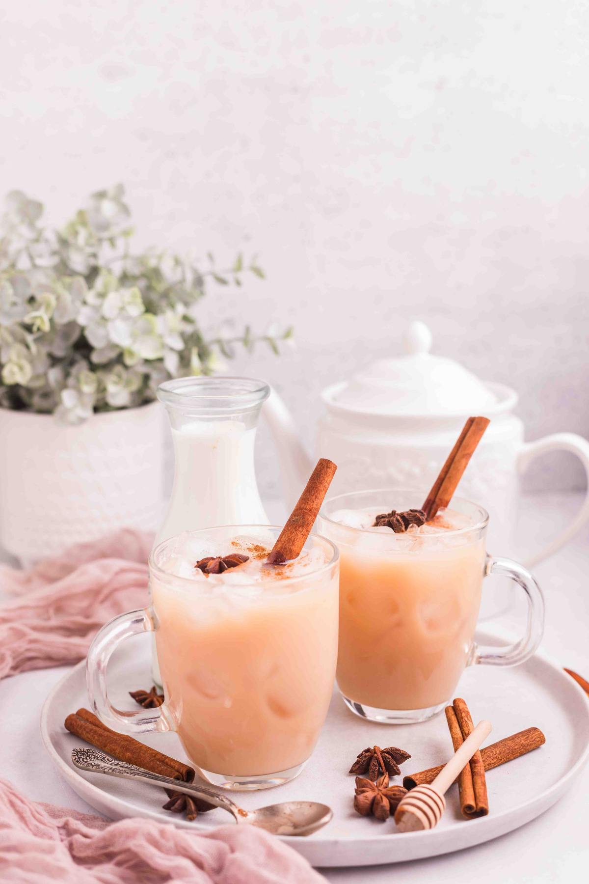 Two glasses of Iced Chai Tea Latte a Starbucks Copycat drink.