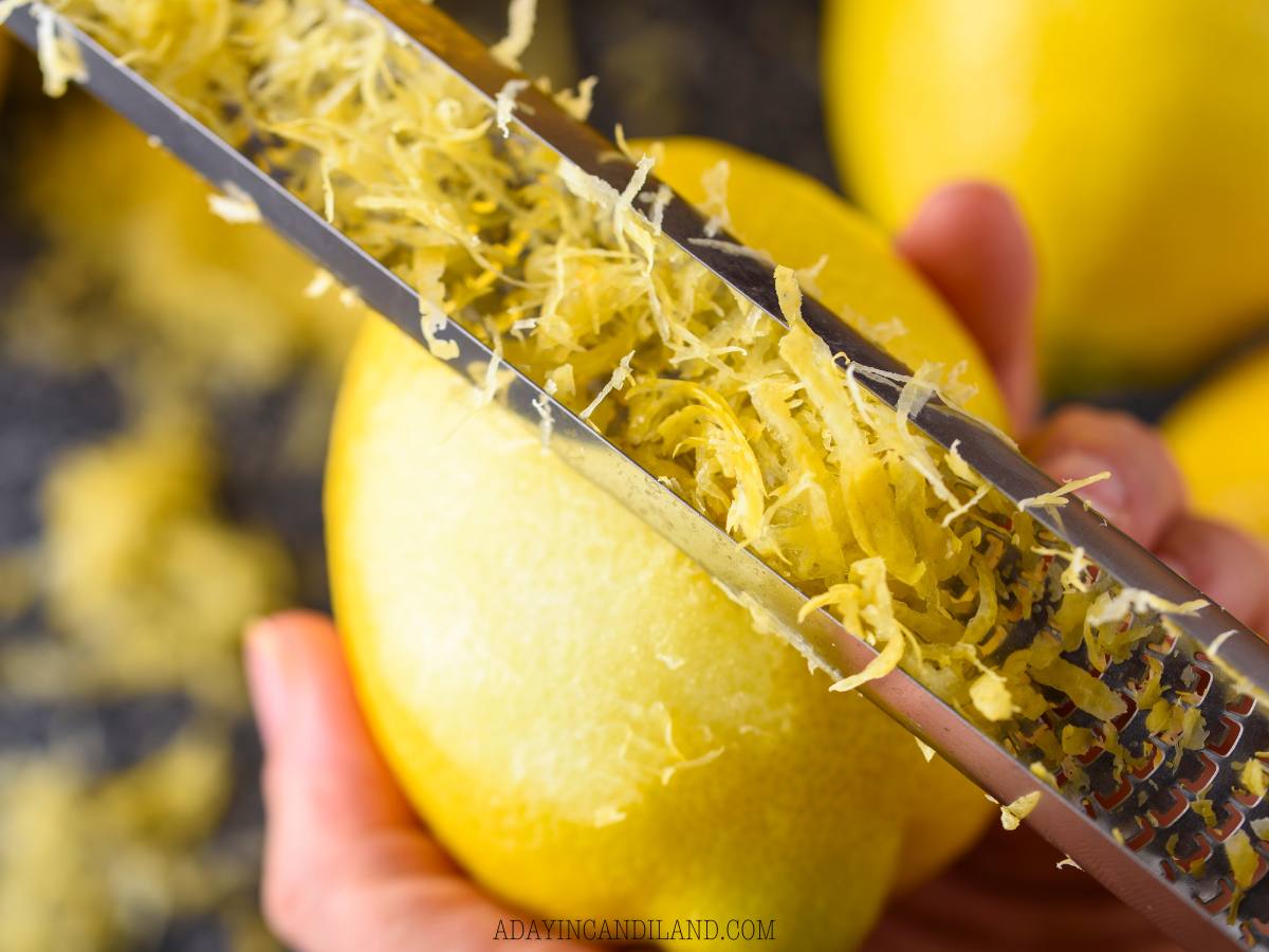 Zesting a lemon with a Microplane. 
