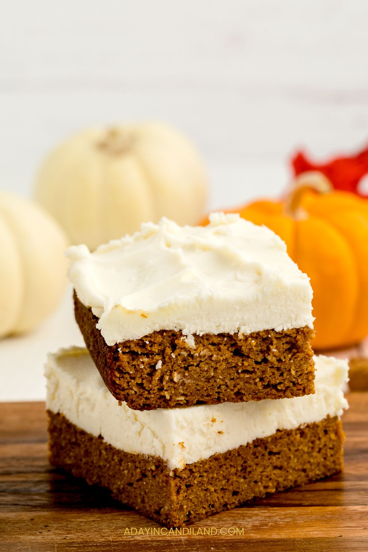 Pumpkin bars stacked on a table.