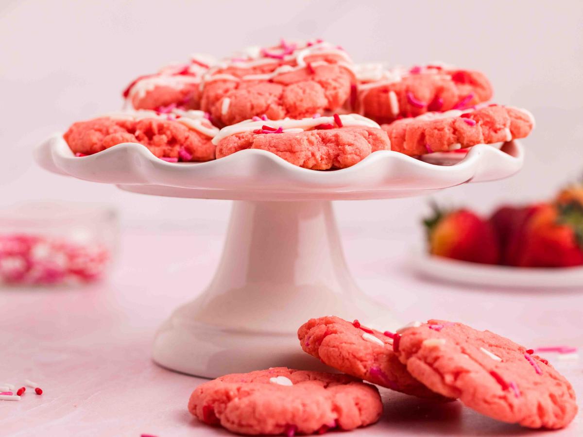 Cake plate with Valentine Cake Cookies on top. 