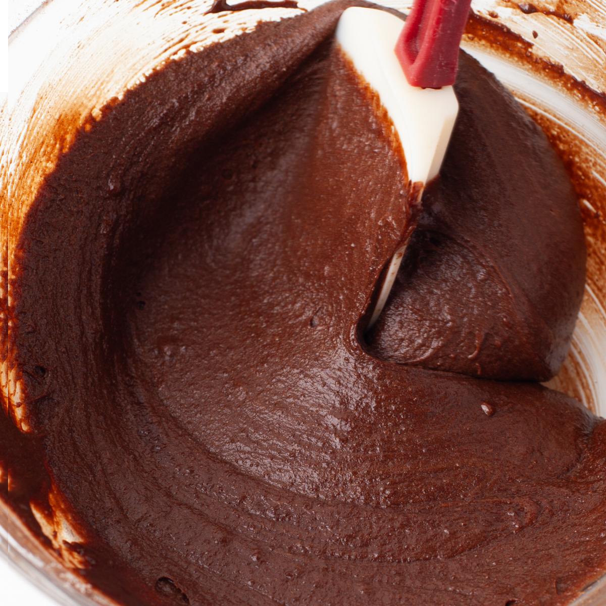 Thick, fudgy brownie batter after the melted chocolate is stirred in.