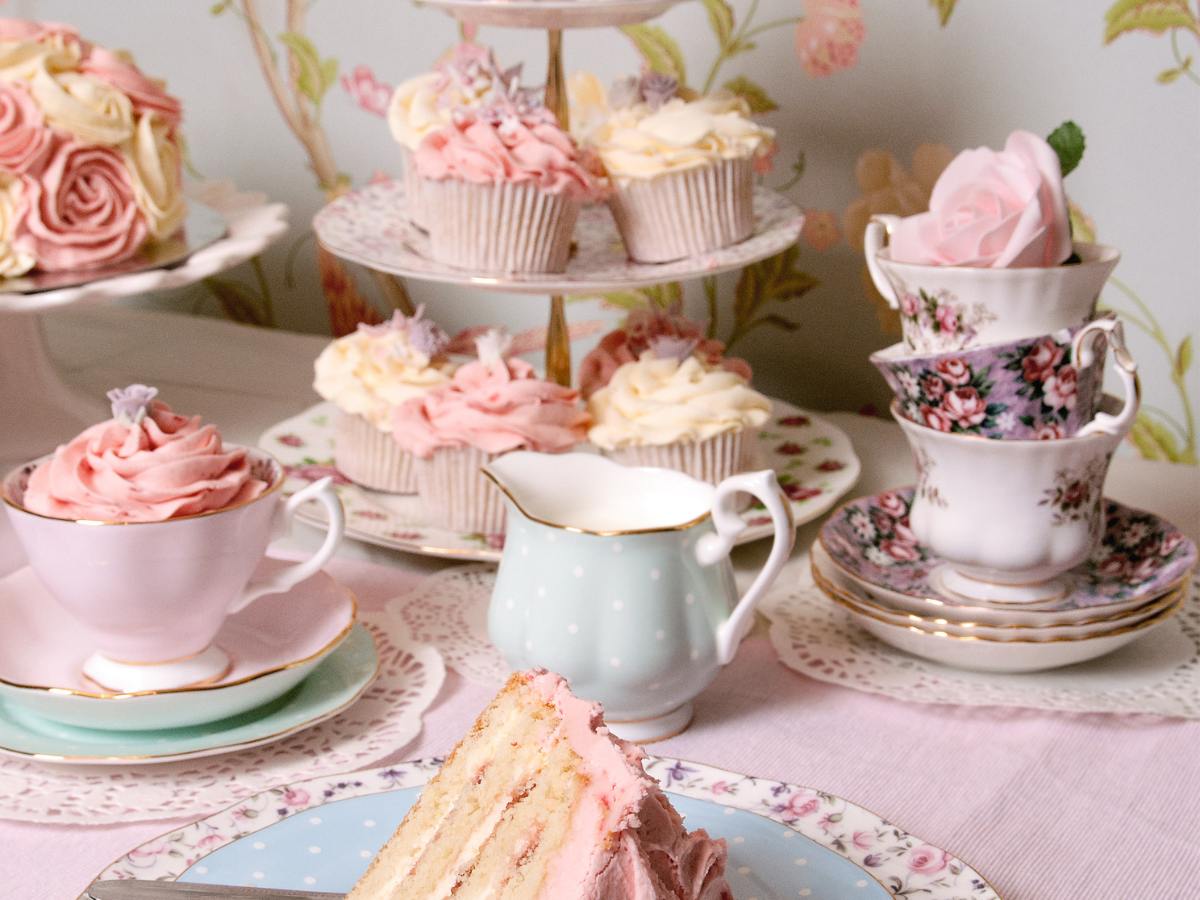 Mother's Day Dessert Table. Setting with flowers, cupcakes, and teacups.