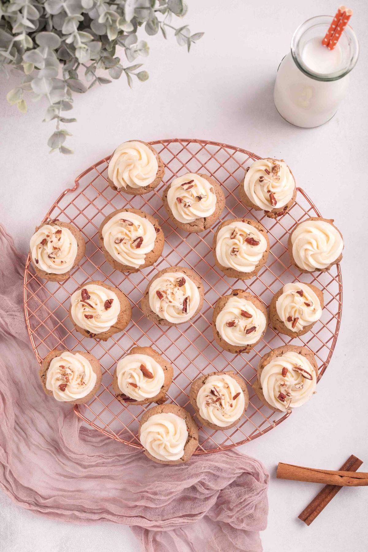 Cooling tray of carrot cake mix cookies, with glass of milk.