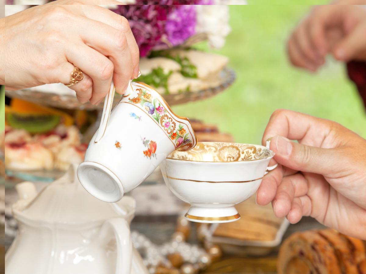 Pouring tea for a Mother's Day Tea. 