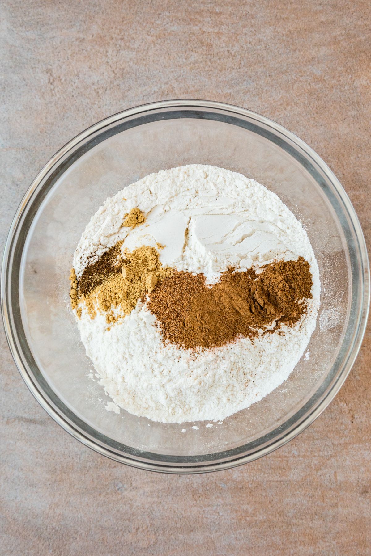 The dry ingredients whisked together: flour, salt, baking powder, cinnamon, ginger, nutmeg and cloves.