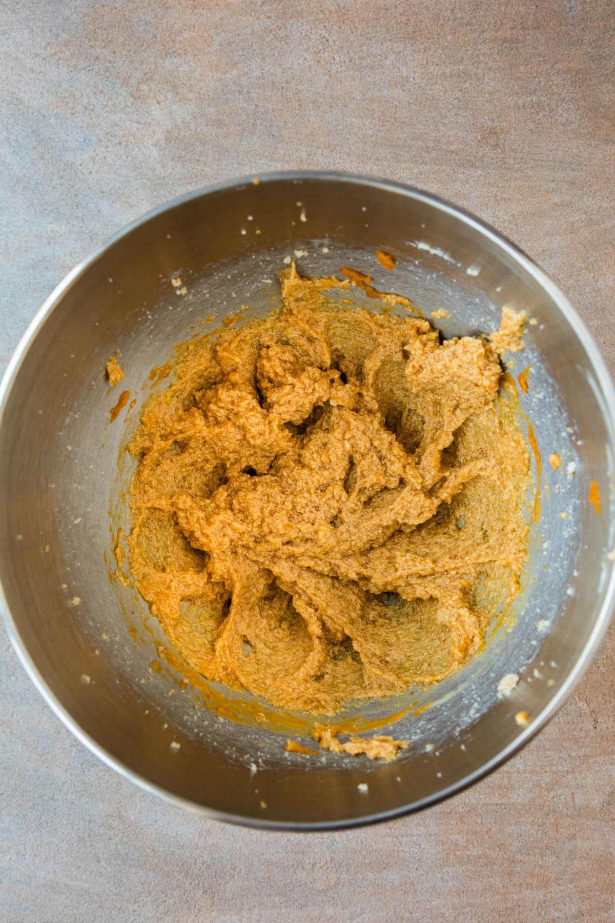 Butter, sugars, egg yolk, pumpkin and vanilla creamed together in the mixer bowl.